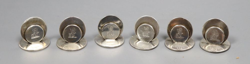 A set of six Edwardian silver menu holders, Sampson Mordan & Co, Chester, 1909, 27mm, with engraved crest.